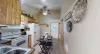 View of the kitchen area from the bathroom entrance.