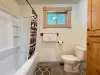 Loft bathroom with deep soaking tub.