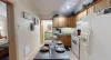 The dining room table is conveniently located within the kitchen for easy access during meals.