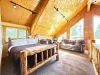 Loft with a Queen bed and additional seating.