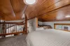 Queen bed in the open loft area.