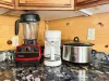 For your cooking convenience, the kitchen comes fully stocked with premium small appliances, including a high-powered Vitamix blender, a drip coffee maker, and a slow cooker.