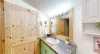 The bathroom is equipped with clean body, hand, and face towels.