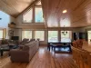The open kitchen blends seamlessly into the cabin's cozy living area, creating a welcoming space perfect for gathering and unwinding.