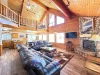 The open kitchen blends seamlessly into the cabin's cozy living area, creating a welcoming space perfect for gathering and unwinding.