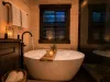 Take a long soak in the soaker bathtub in the master shared bathroom.