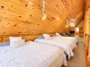 Three queen beds in the loft overlooking the living room.