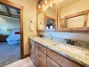 Ensuite Master bathroom with double vanity and standing shower.