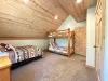 Bedroom #1 located upstairs with a Queen and a bunk bed.