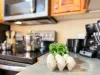 The openness of the kitchen makes it easy to chat with friends or family while cooking, or to catch the glow of the fire and the sound of laughter as you move between the rooms.