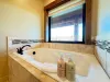 Soaking tub in the master bedroom.