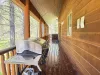 Open porch to the hot tub. Grill right off the kitchen.