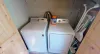 Laundry closet with full size washer and dryer. Laundry soap is provided.