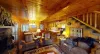 The living room has plenty of seating for everyone to enjoy.
