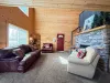 Relax by the striking floor-to-ceiling stone fireplace in the main living space, offering an exceptionally warm and welcoming entry into your mountain getaway.